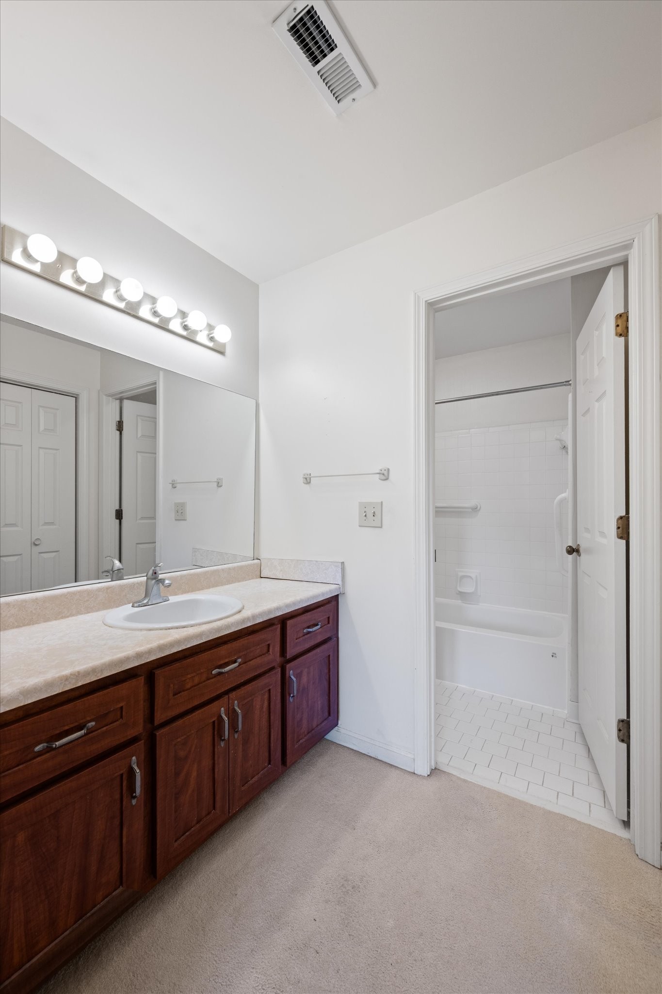 768 Kent Road Nashville, TN 37214 - Photo 15 of 20 a spacious bathroom with a double vanity sink a mirror and a bathtub