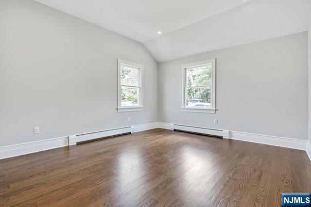26 Bogert Street Closter, NJ 07624 - Photo 14 of 18 an empty room with wooden floor and windows