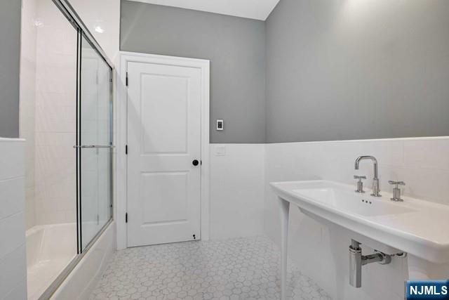 26 Bogert Street Closter, NJ 07624 - Photo 18 of 18 a bathroom with a sink and a mirror