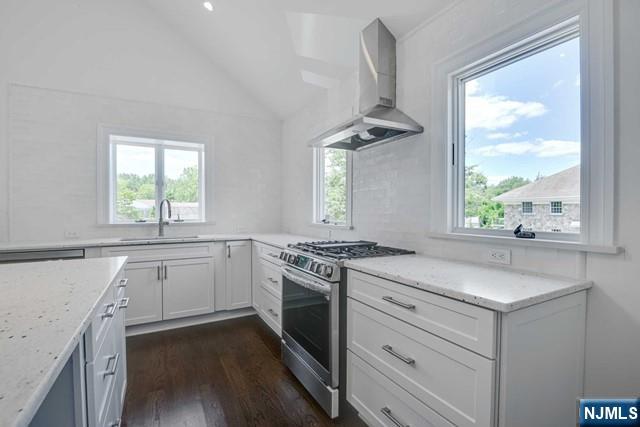 26 Bogert Street Closter, NJ 07624 - Photo 6 of 18 a kitchen with a stove a sink and a window
