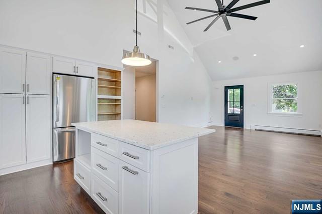 26 Bogert Street Closter, NJ 07624 - Photo 8 of 18 a kitchen with stainless steel appliances a refrigerator and a hard wood floor