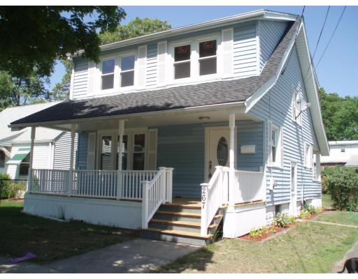 267 Abbott Street Springfield, MA 01118 - Photo 1 of 25 a front view of a house with a yard