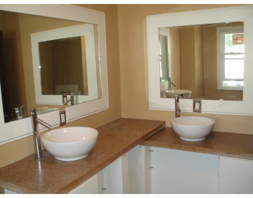 267 Abbott Street Springfield, MA 01118 - Photo 16 of 25 a bathroom with a granite countertop sink and a mirror