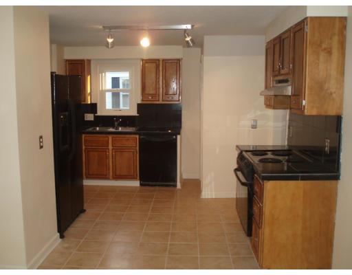 267 Abbott Street Springfield, MA 01118 - Photo 20 of 25 a kitchen with granite countertop a refrigerator stove and sink