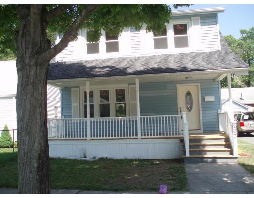 267 Abbott Street Springfield, MA 01118 - Photo 2 of 25 a front view of a house with a garden