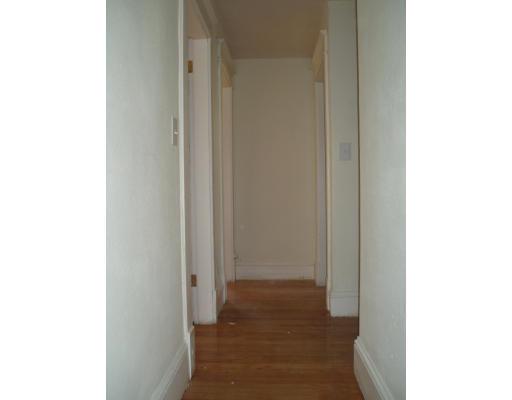 267 Abbott Street Springfield, MA 01118 - Photo 8 of 25 a view of a hallway with wooden floor