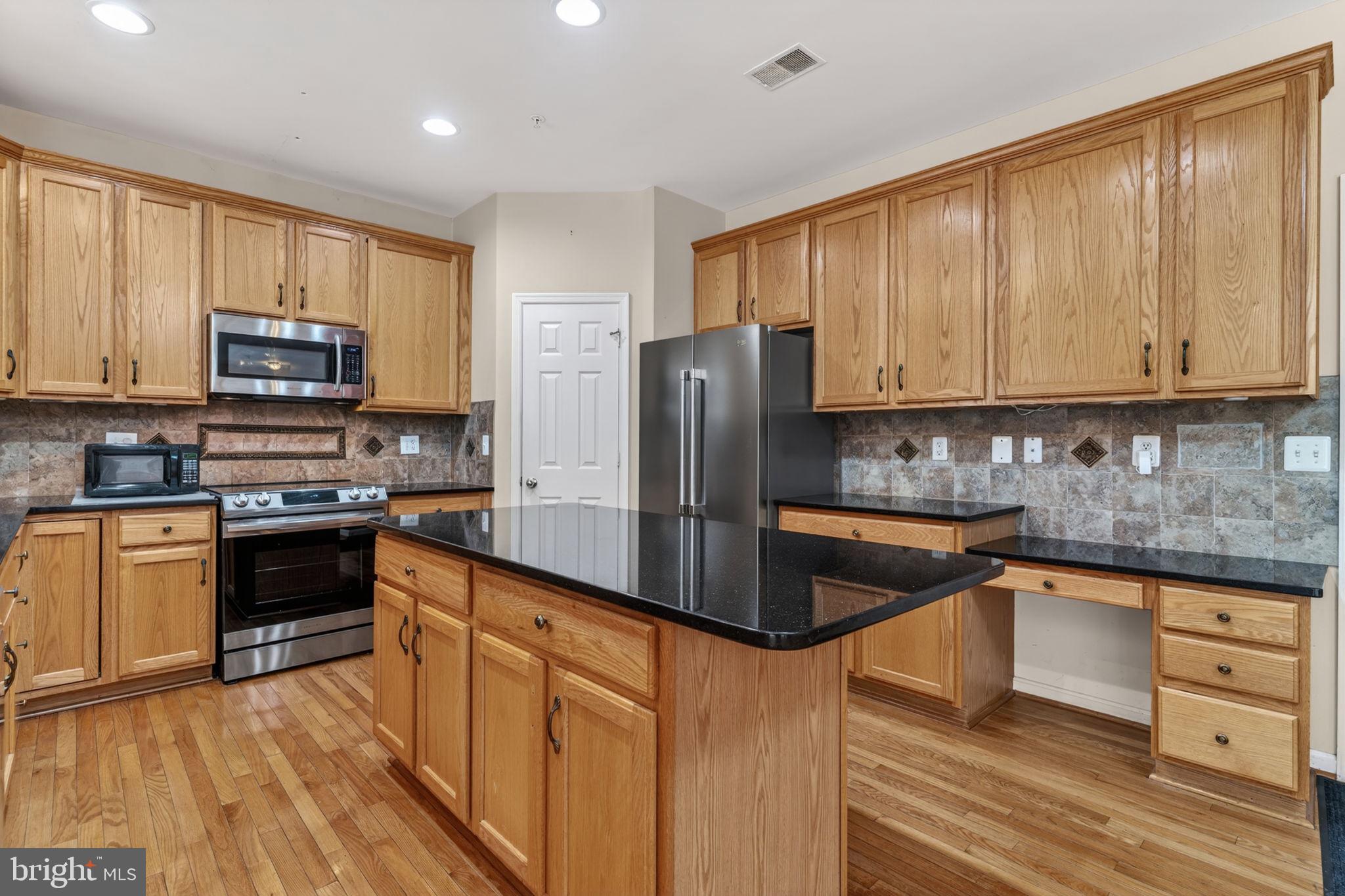 1200 Strausberg Street Accokeek, MD 20607 - Photo 5 of 47 Renovated Kitchen w/ granite tops & SS appliances