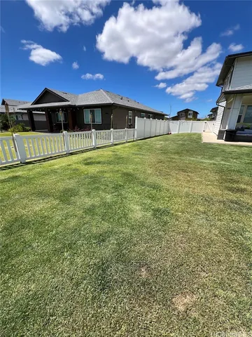 a view of a big yard with a house