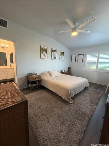 a bedroom with a bed and a couch