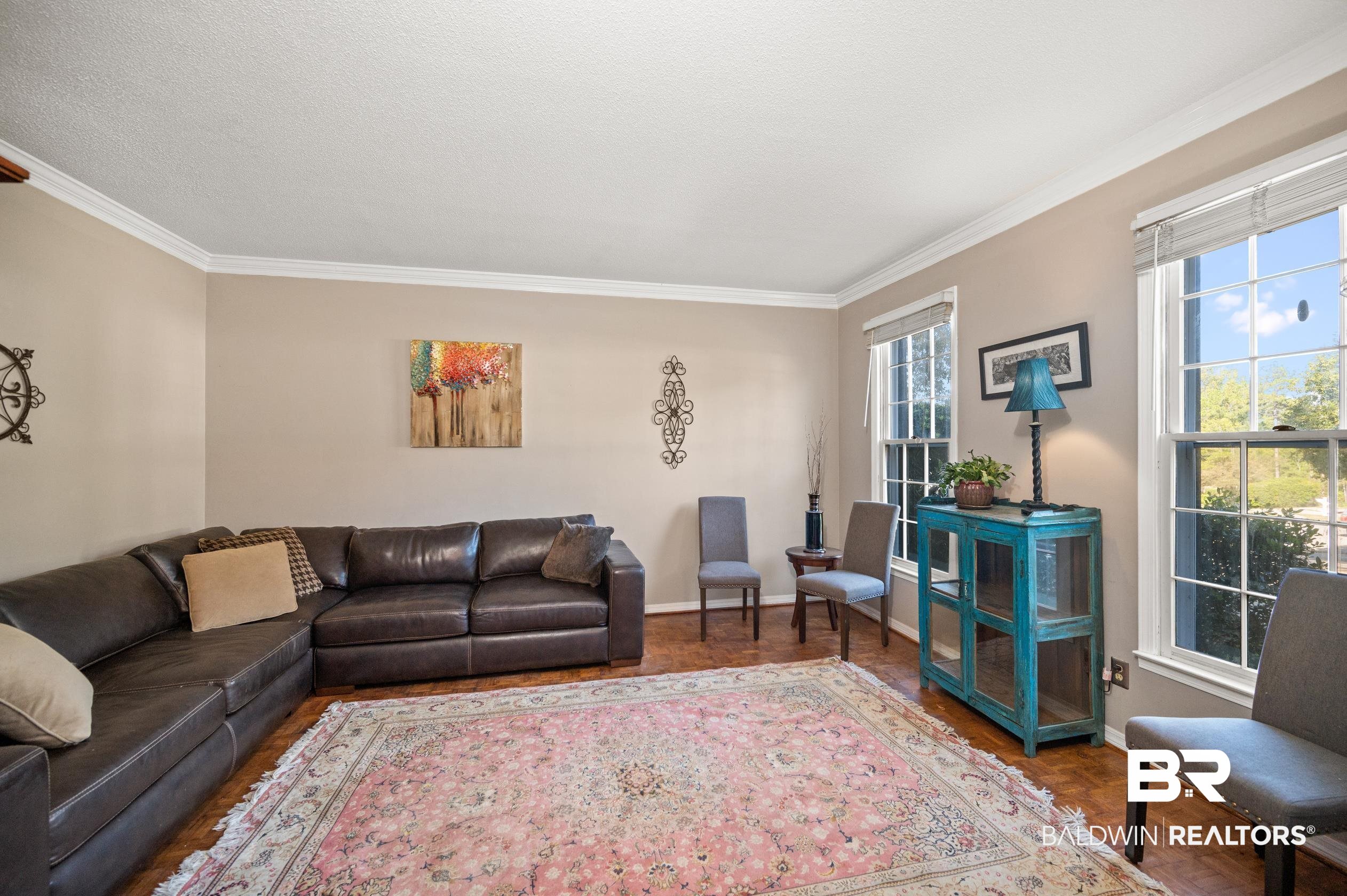 6705 Ridgeland Road South Mobile, AL 36695 - Photo 6 of 44 Living room with crown molding, a textured ceiling, and hardwood / wood-style flooring