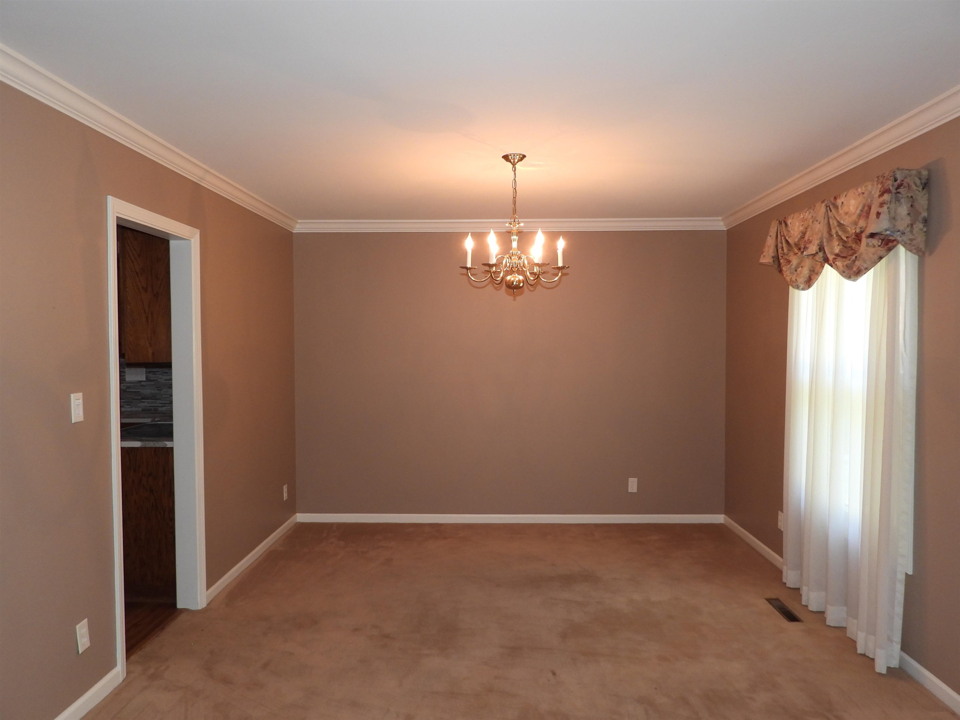 4610 Sunderman Road Rockford, IL 61114 - Photo 3 of 20 a view of an empty room with a window