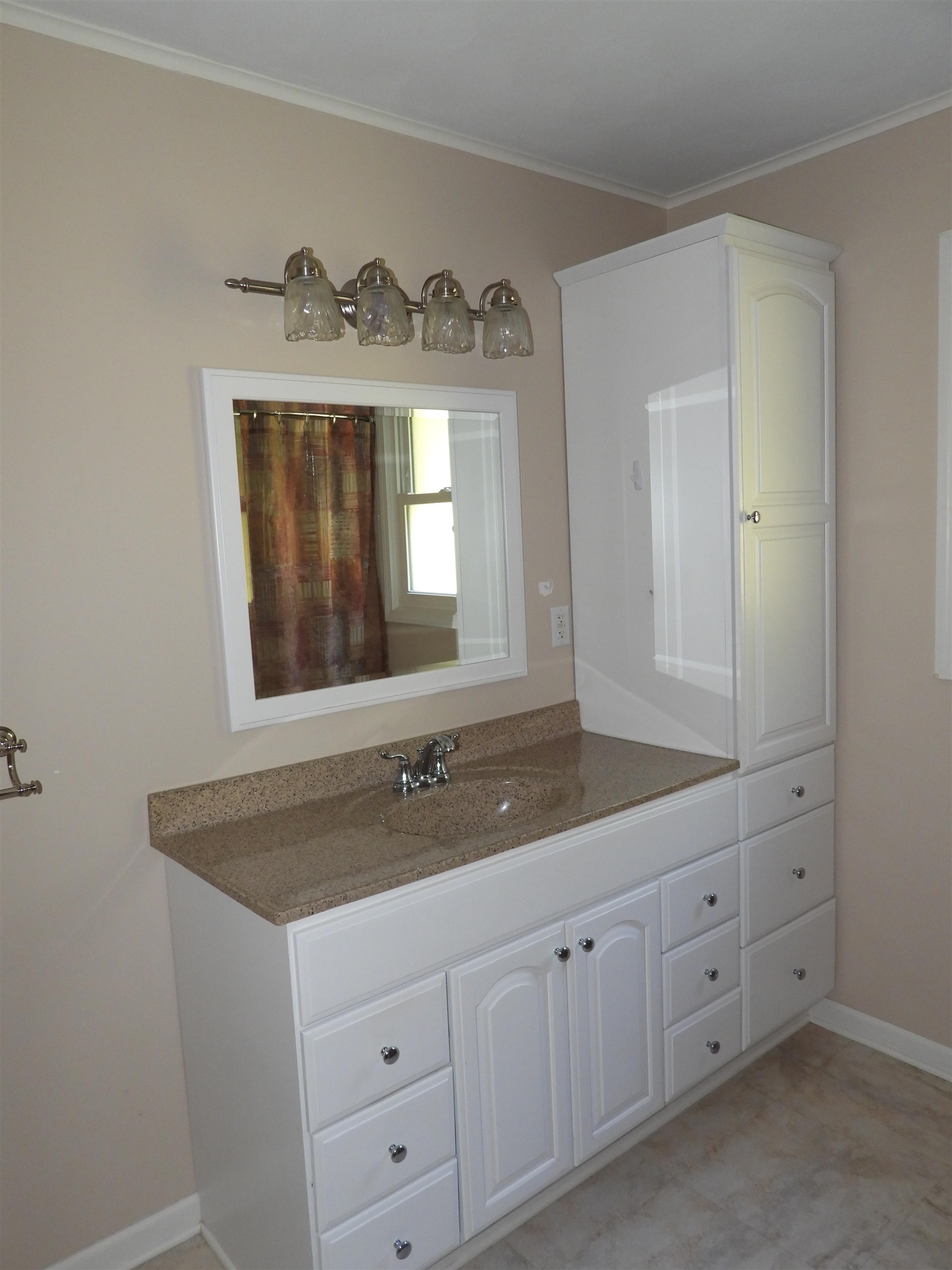 4610 Sunderman Road Rockford, IL 61114 - Photo 10 of 20 a bathroom with a sink and a mirror