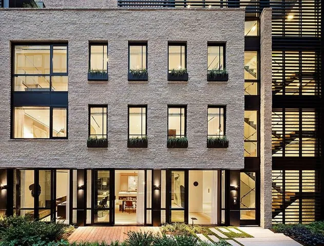 a front view of a building with large windows