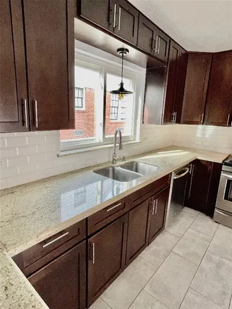 a kitchen with a sink and cabinets