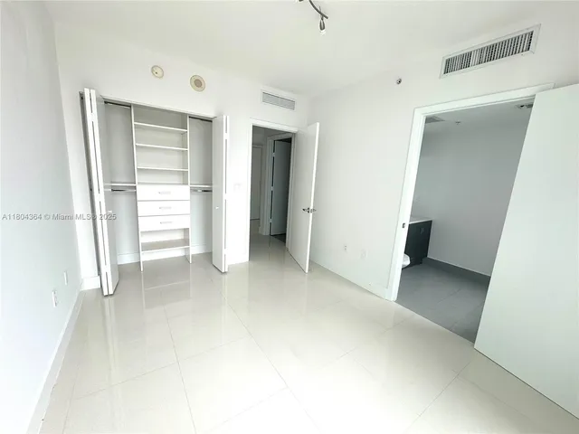 a white bath tub sitting next to a window