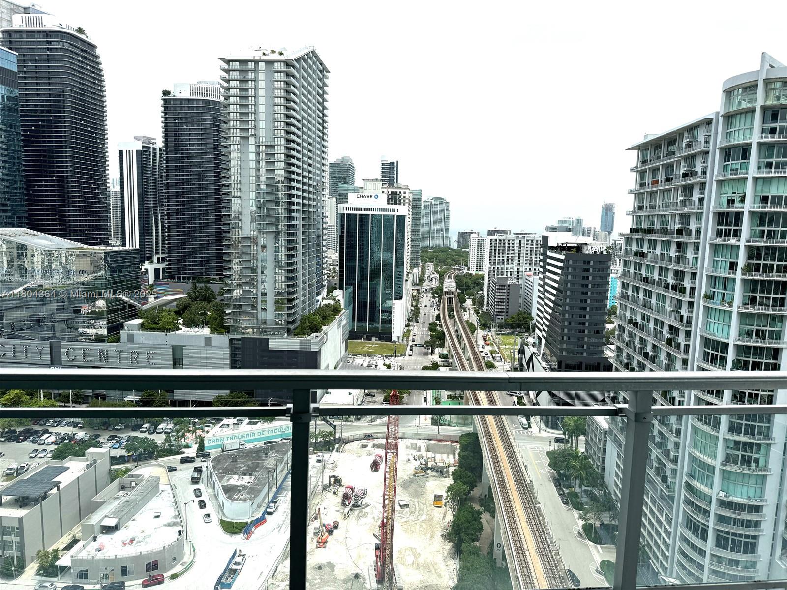 92 Southwest 3rd Street, Unit 1605 Miami, FL 33130 - Photo 7 of 21 a view of a city skyline from a balcony