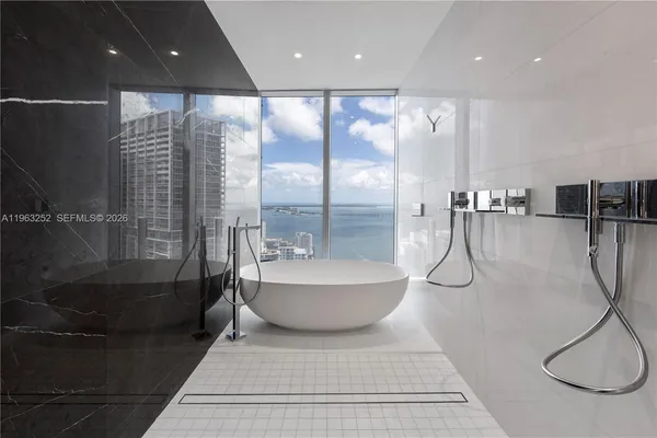 a bathroom with a shower and a sink