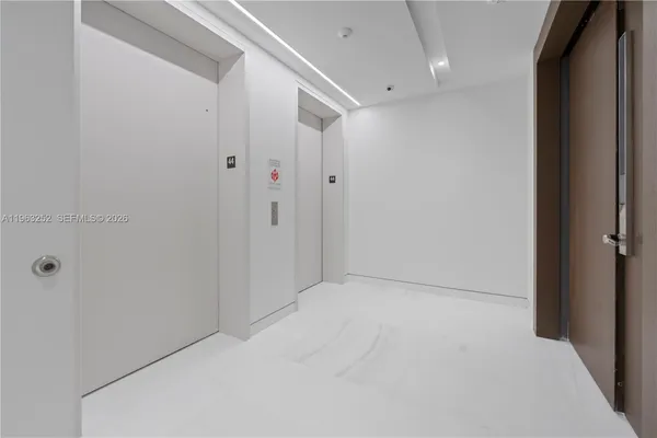 a room with windows and view of living room