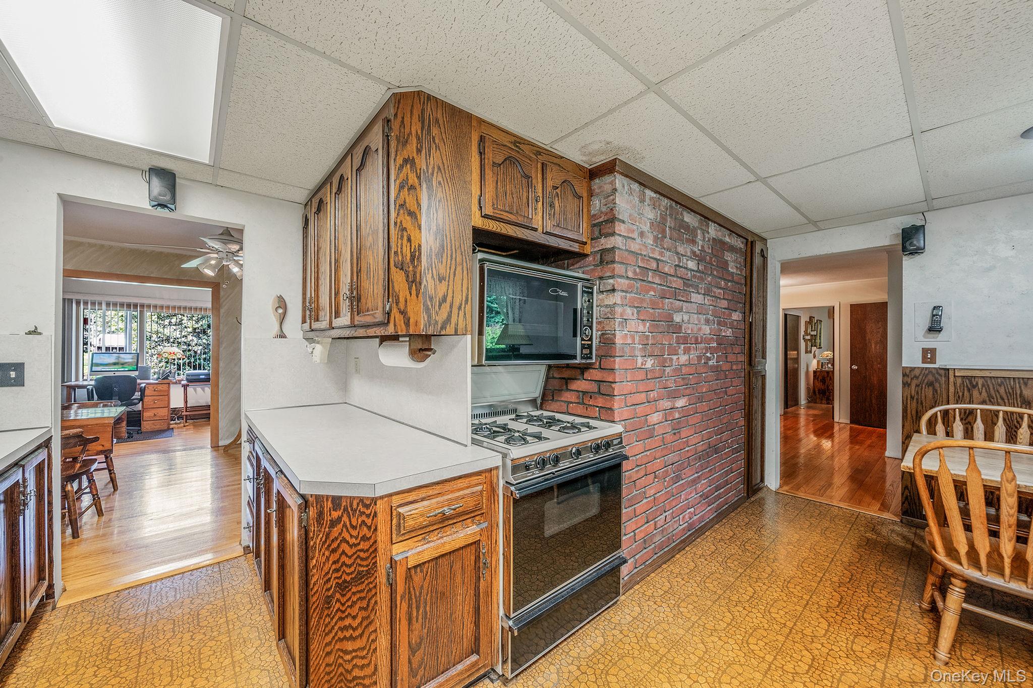280 Deforest Road North Dix Hills, NY 11746 - Photo 30 of 37 a kitchen with stainless steel appliances granite countertop a stove and cabinets