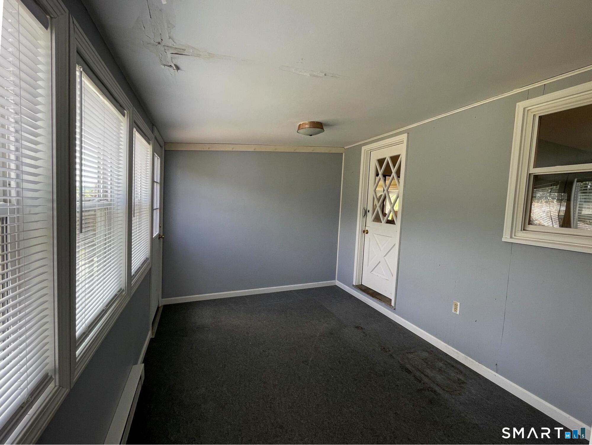 18 Old South Cove Road Old Saybrook, CT 06475 - Photo 22 of 40 an empty room with windows