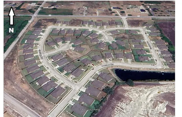 a bathroom with a bathtub and a double vanity