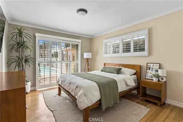 a bedroom with a large bed and a large window