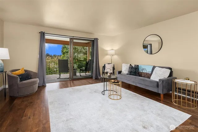 a living room with furniture and a large window