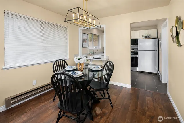 a view of a dining room with furniture window and wooden floor