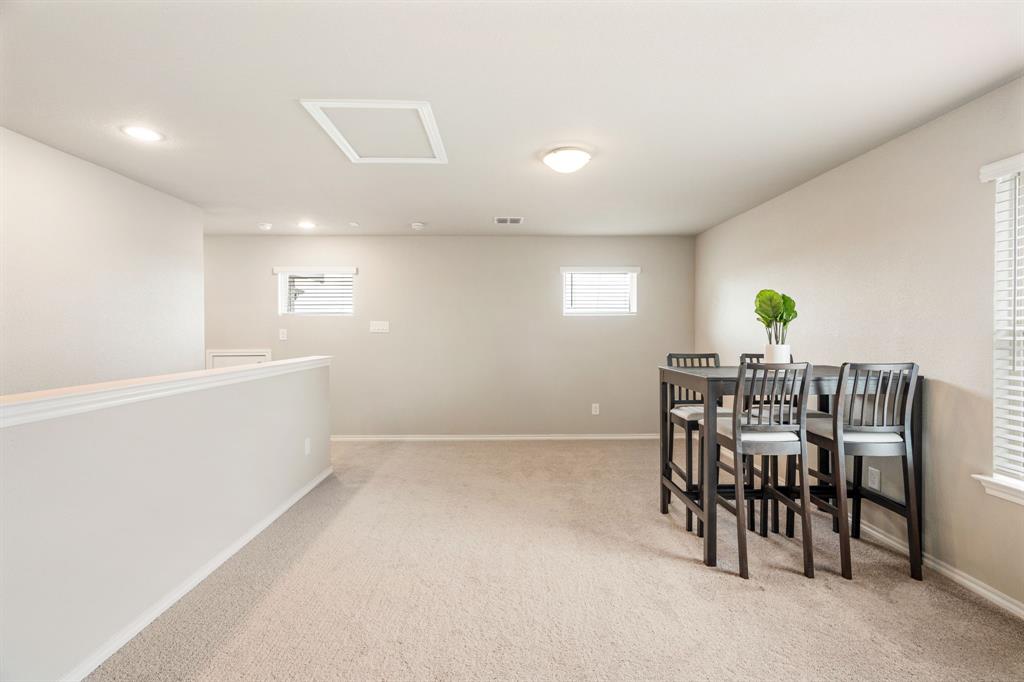 321 Pasture Drive Midlothian, TX 76065 - Photo 21 of 40 a view of a dining room with furniture and chandelier