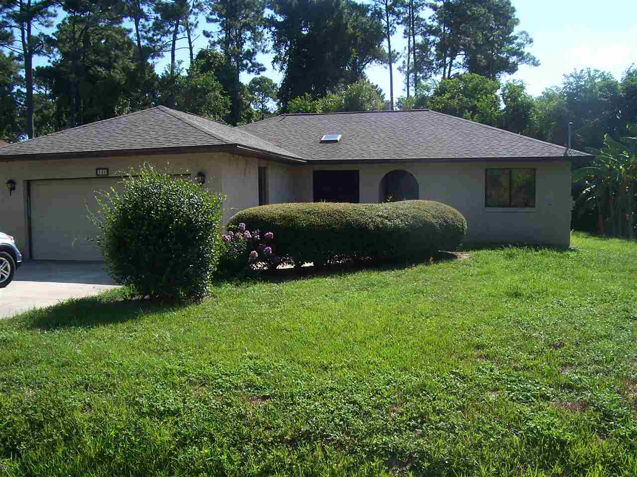 145 Cornell Road St. Augustine, FL 32086 - Photo 1 of 10 a view of a house with a garden