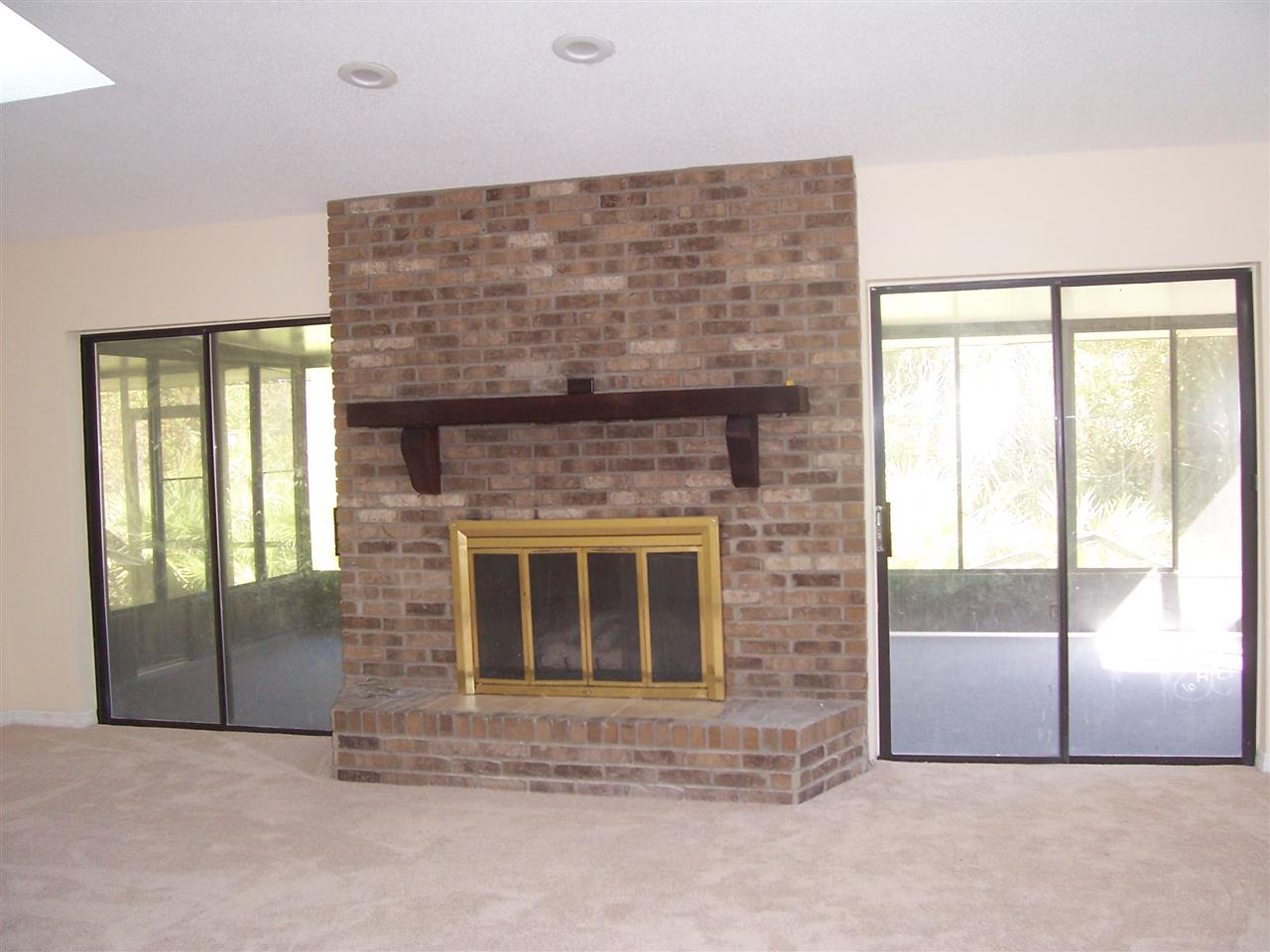 145 Cornell Road St. Augustine, FL 32086 - Photo 5 of 10 a living room with a fireplace