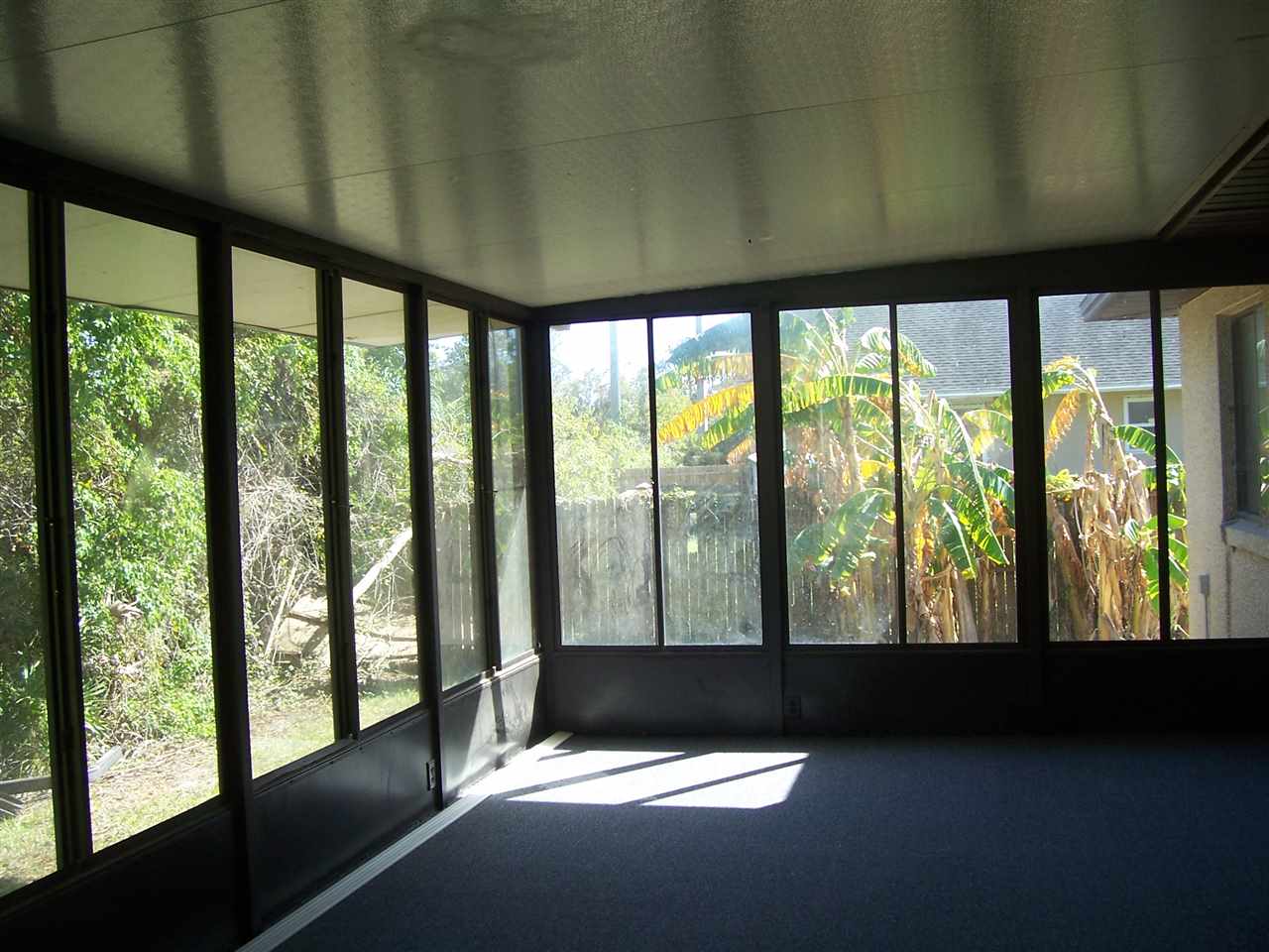 145 Cornell Road St. Augustine, FL 32086 - Photo 9 of 10 a view of an empty room with a floor to ceiling window
