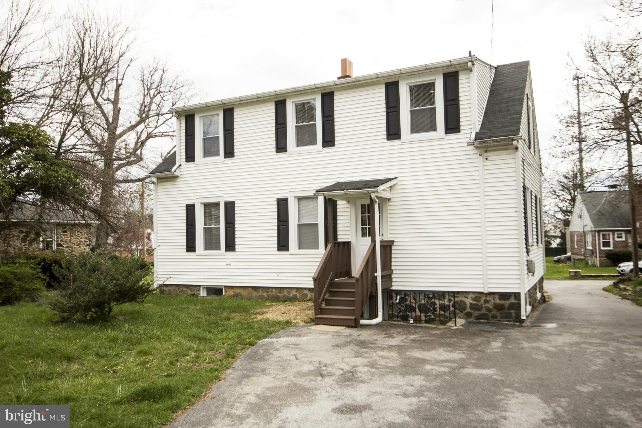 3612 Eitemiller Road Baltimore, MD 21244 - Photo 4 of 30 a view of a white house with a yard