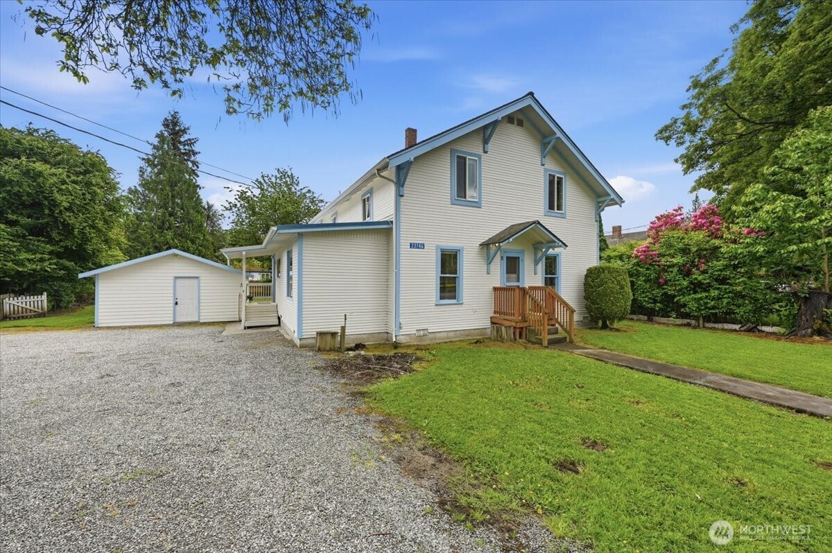 23746 Old Day Creek Road, Unit A & B Sedro-Woolley, WA 98284 - Photo 1 of 36 a front view of a house with a yard and garage