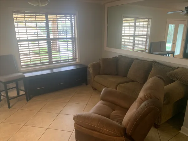 a living room with furniture and a window