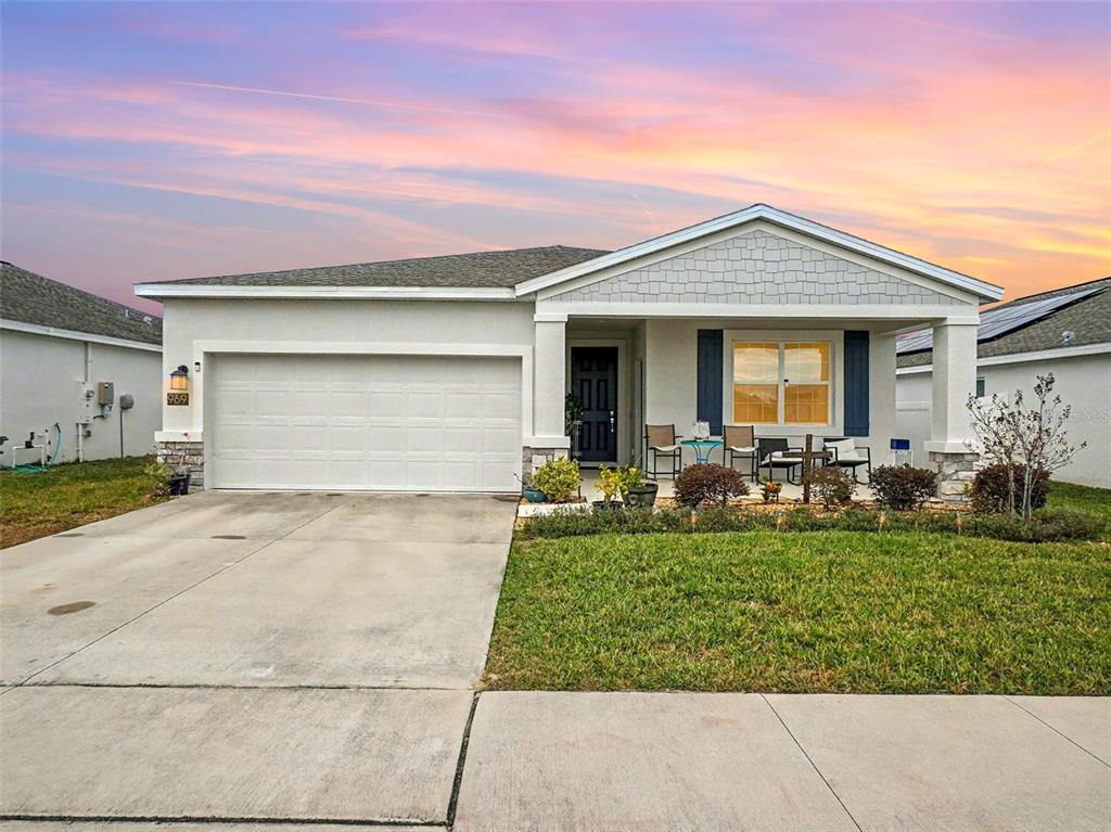 a front view of house with outdoor seating
