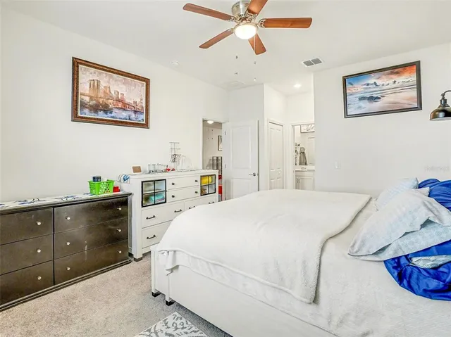 a bedroom with a bed and a cabinets