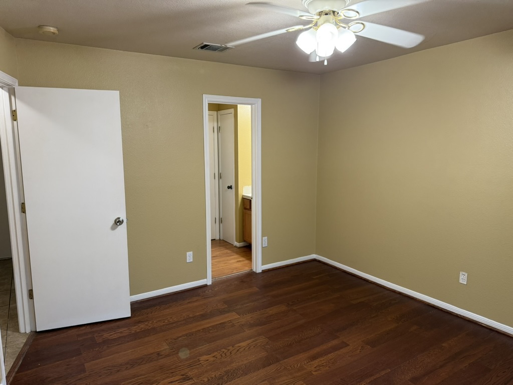 1707 Morningside Cove Round Rock, TX 78664 - Photo 13 of 31 a view of an empty room with wooden floor