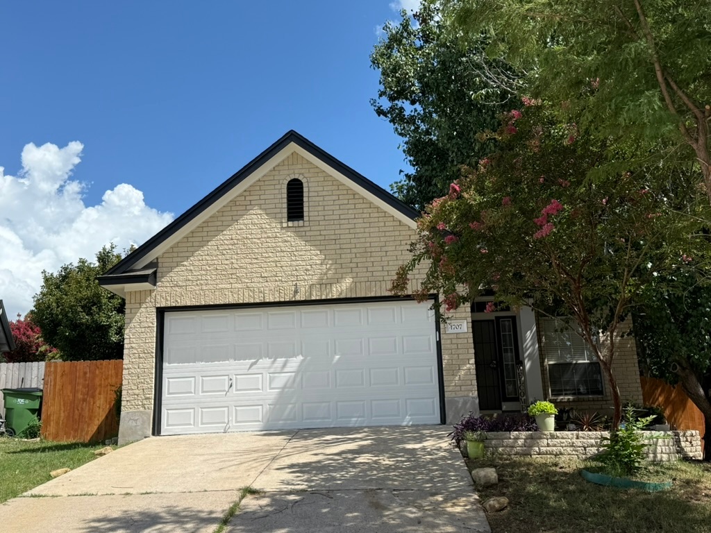 1707 Morningside Cove Round Rock, TX 78664 - Photo 23 of 31 a front view of a house with garden