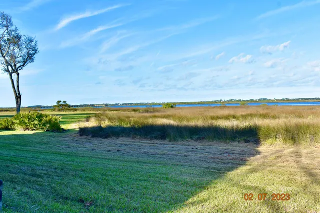 a view of a lake with a yard