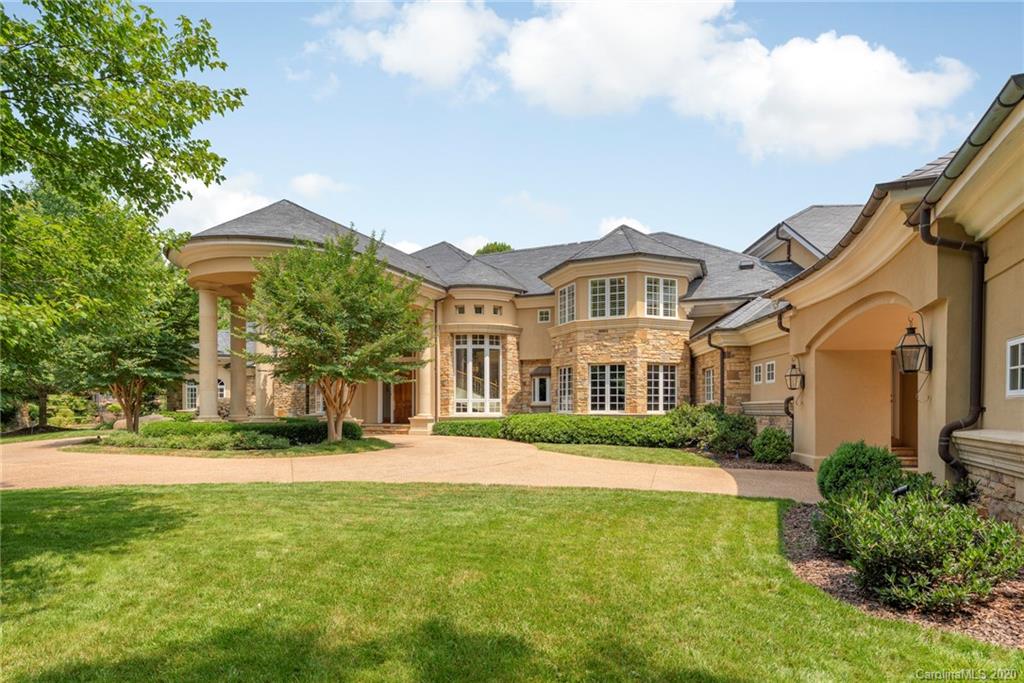 8333 Providence Road Charlotte, NC 28277 - Photo 2 of 47 a front view of a house with a garden