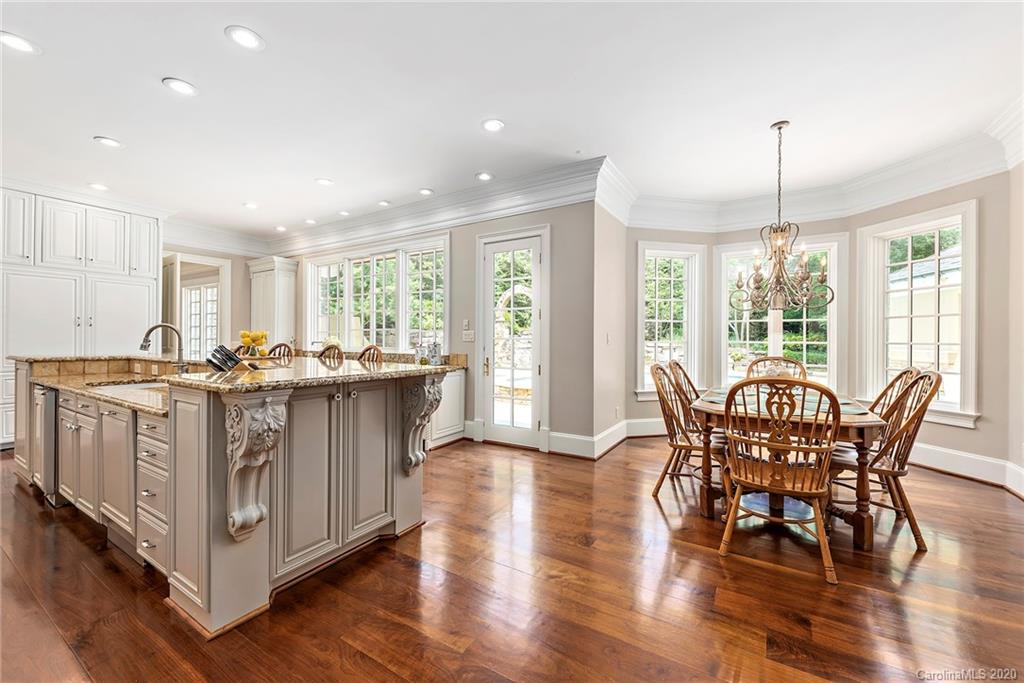 8333 Providence Road Charlotte, NC 28277 - Photo 12 of 47 a view of a dining room with furniture window and wooden floor