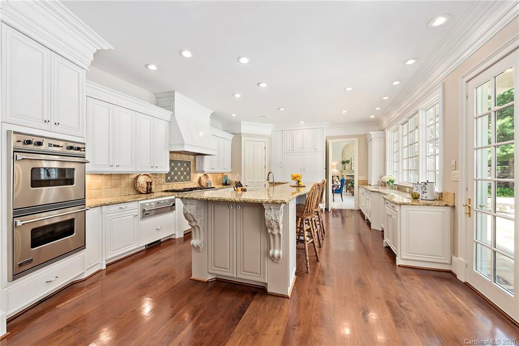 8333 Providence Road Charlotte, NC 28277 - Photo 14 of 47 a kitchen with white cabinets and appliances