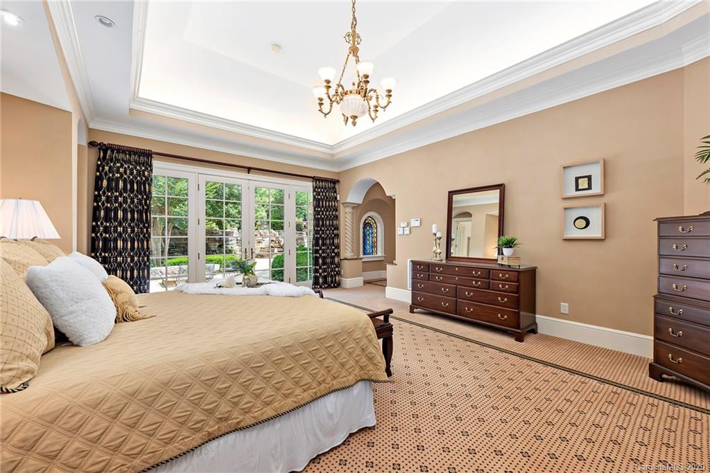 8333 Providence Road Charlotte, NC 28277 - Photo 16 of 47 a bedroom with a bed dresser and a window