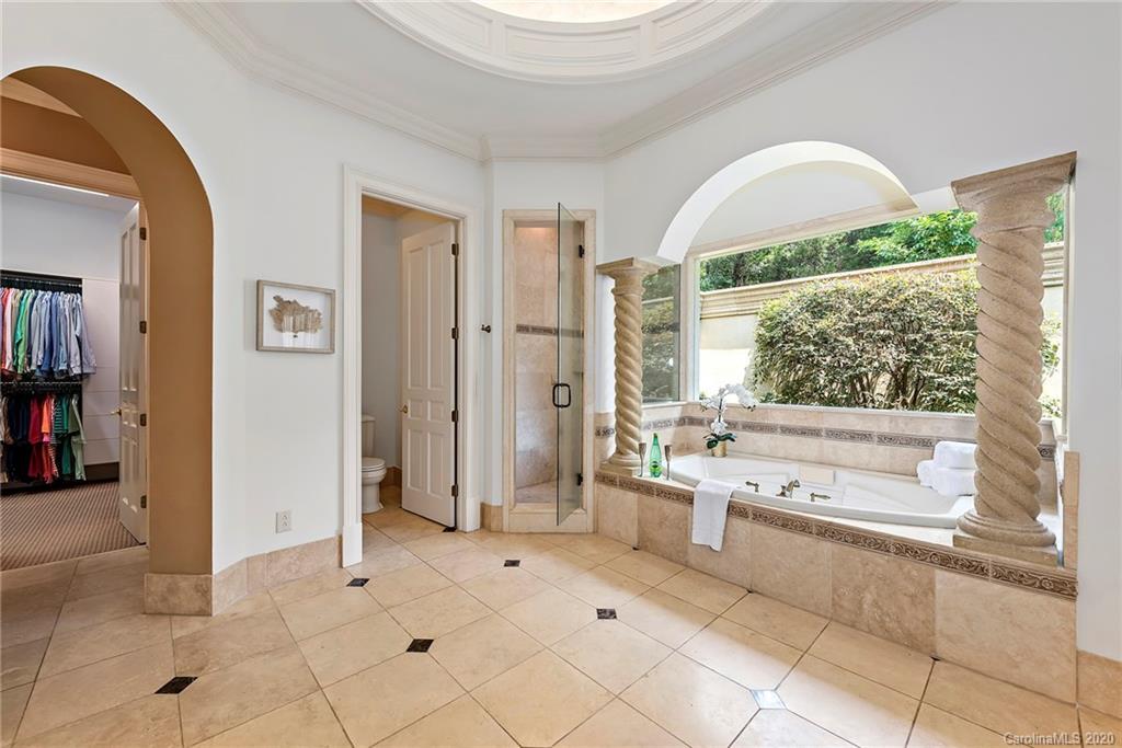 8333 Providence Road Charlotte, NC 28277 - Photo 18 of 47 a large white kitchen with a large window