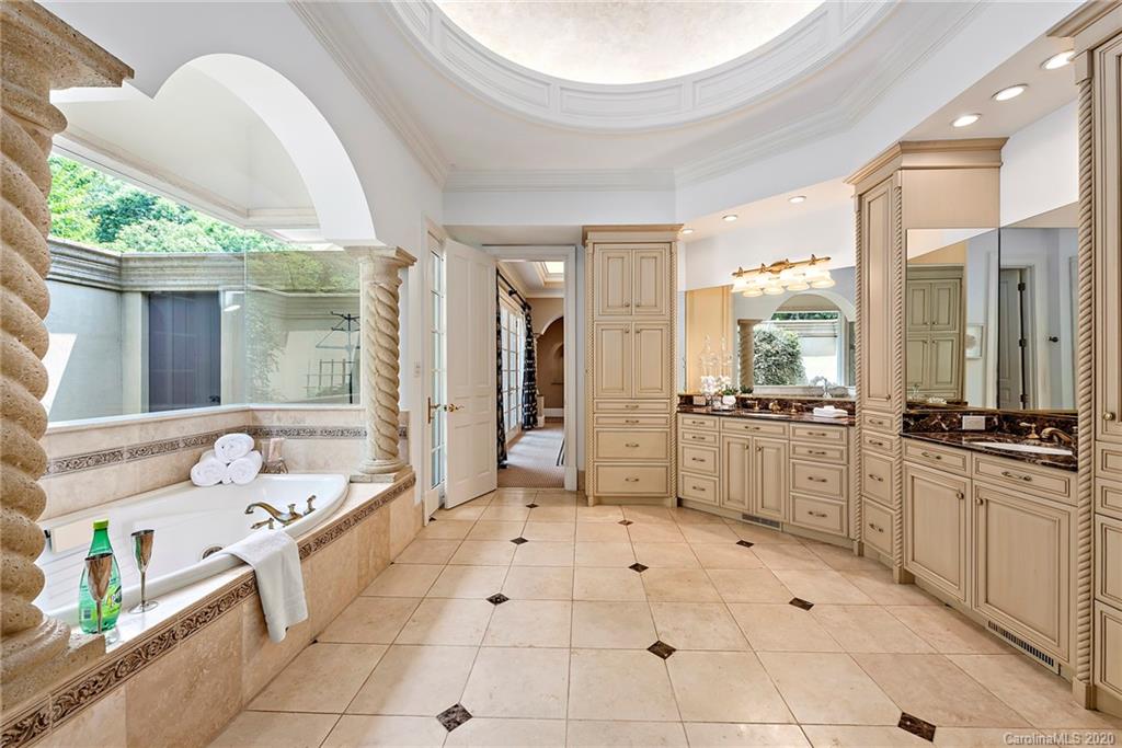 8333 Providence Road Charlotte, NC 28277 - Photo 19 of 47 a bathroom with a tub sink and mirror