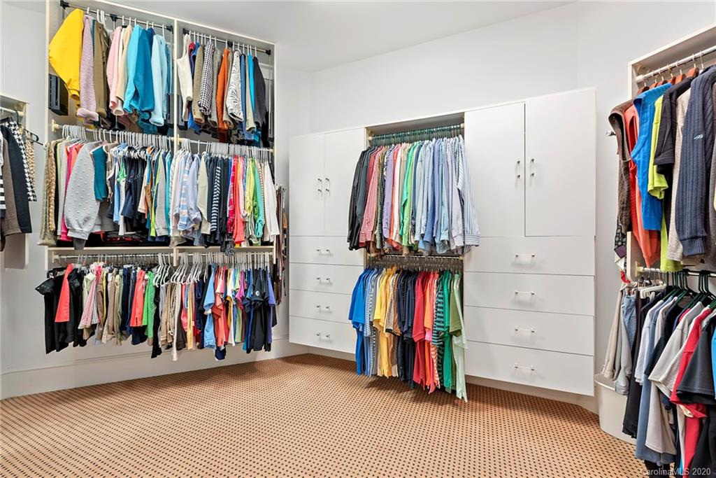 8333 Providence Road Charlotte, NC 28277 - Photo 20 of 47 a view of walk in closet with clothes and shoes