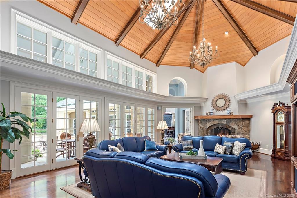 8333 Providence Road Charlotte, NC 28277 - Photo 22 of 47 a living room with furniture a fireplace and a large window