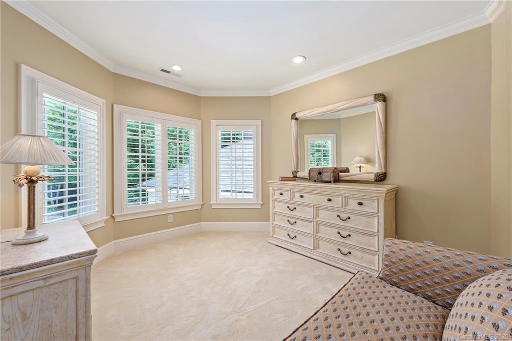 8333 Providence Road Charlotte, NC 28277 - Photo 30 of 47 a bedroom with a bed and a dresser