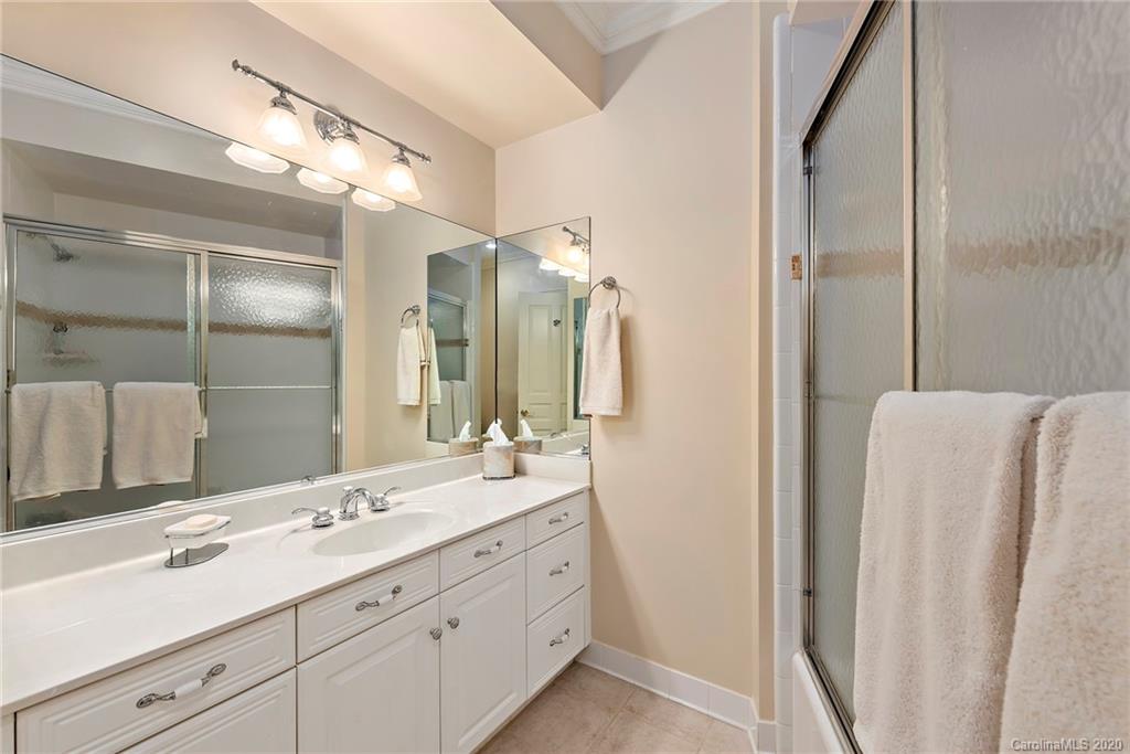 8333 Providence Road Charlotte, NC 28277 - Photo 33 of 47 a bathroom with a double vanity sink and a mirror